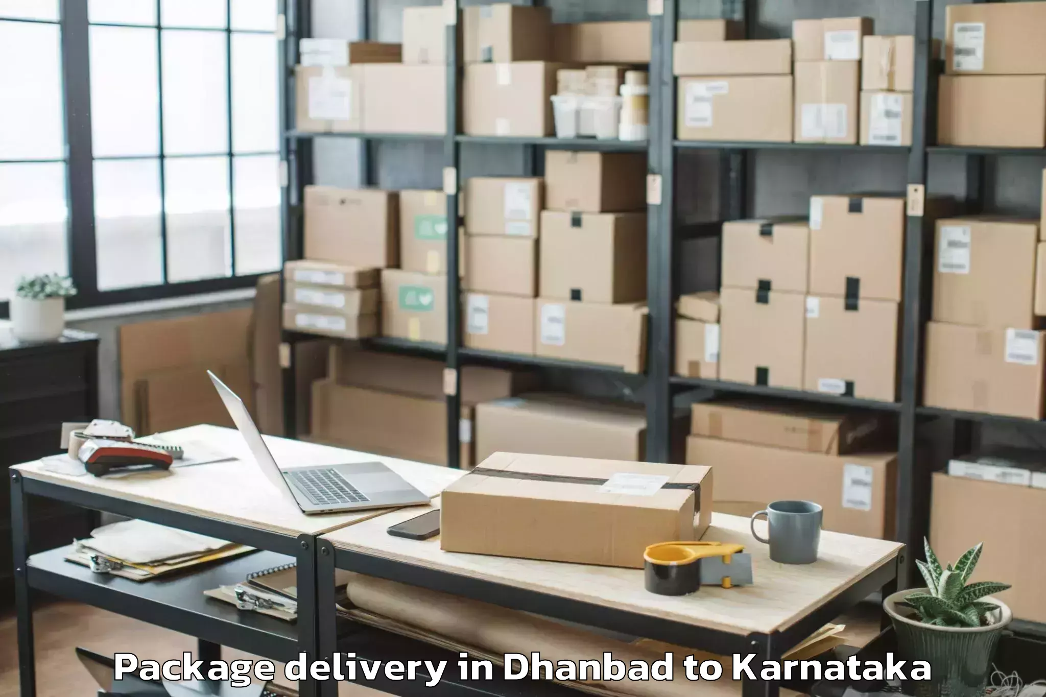 Dhanbad to Kannada University Vidyaranya Package Delivery Booking